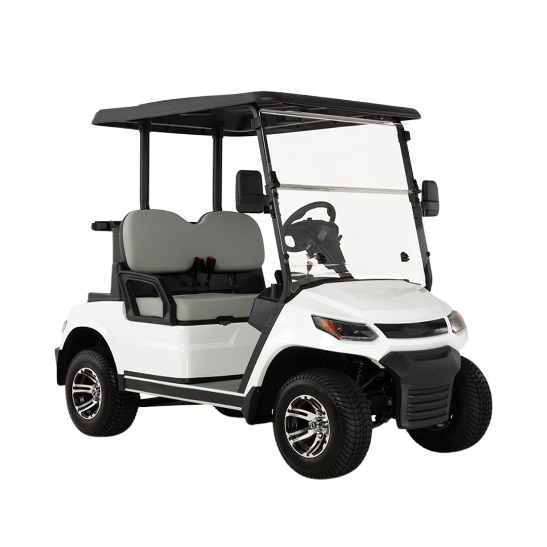 uae golf cartz three-quarter front studio shot of a white four-seater golf cart with a black roof and a modern front design, set against a pure white background. This electric vehicle features light gray seats, a full windshield, and black fender flares. The golf cart is equipped with all-terrain tires and custom black and chrome wheels, highlighting its contemporary style and practicality.