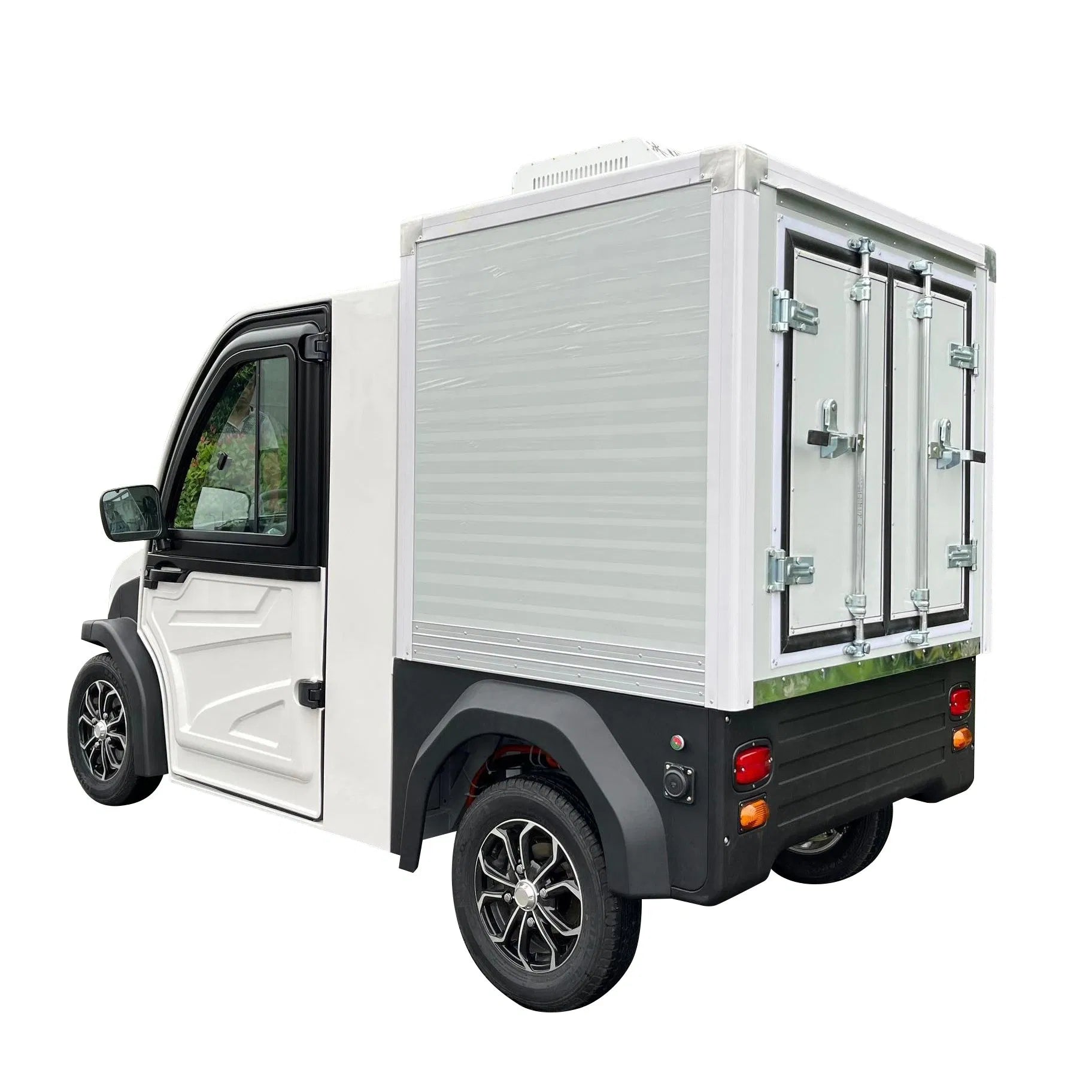 UAE golf cartz rear three-quarter studio shot of a white electric refrigerated delivery vehicle with an enclosed cab, set against a white background. This compact electric NEV or refrigerator work cart features a silver insulated rear cargo box with double doors and a top-mounted refrigeration unit. The vehicle has black fender flares and custom black and silver wheels, highlighting its use for cold chain last-mile delivery.