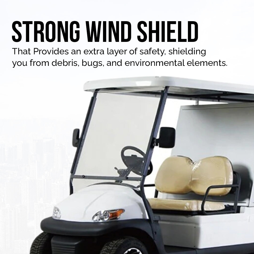 UAE golf cartz promotional image highlighting the strong windshield of a white utility golf cart with a rear storage cabinet. The image focuses on the clear, full-height windshield, with text promoting its role in shielding against debris, bugs, and environmental elements for safety. The two-seater electric work cart features tan seats and a white roof, emphasizing a key safety feature for this service vehicle.