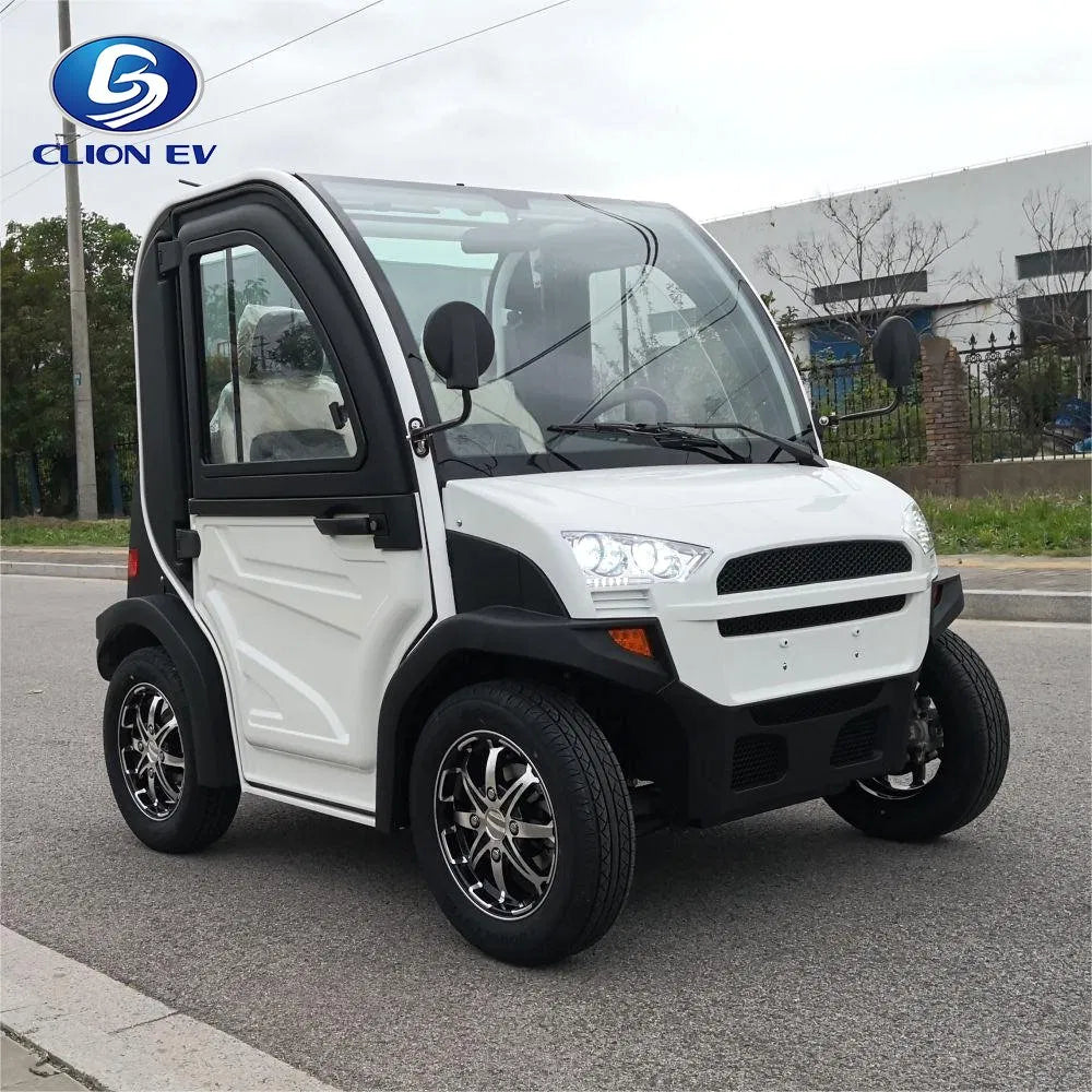 UAE golf cartz three-quarter front view of a white and black two-seater electric vehicle with a fully enclosed cab and a curved glass roof. This modern compact NEV or low-speed electric car is parked on an asphalt street, featuring black trim, a large windshield, and black fender flares. It is equipped with custom black and chrome alloy wheels, highlighting its all-weather neighborhood electric car design.