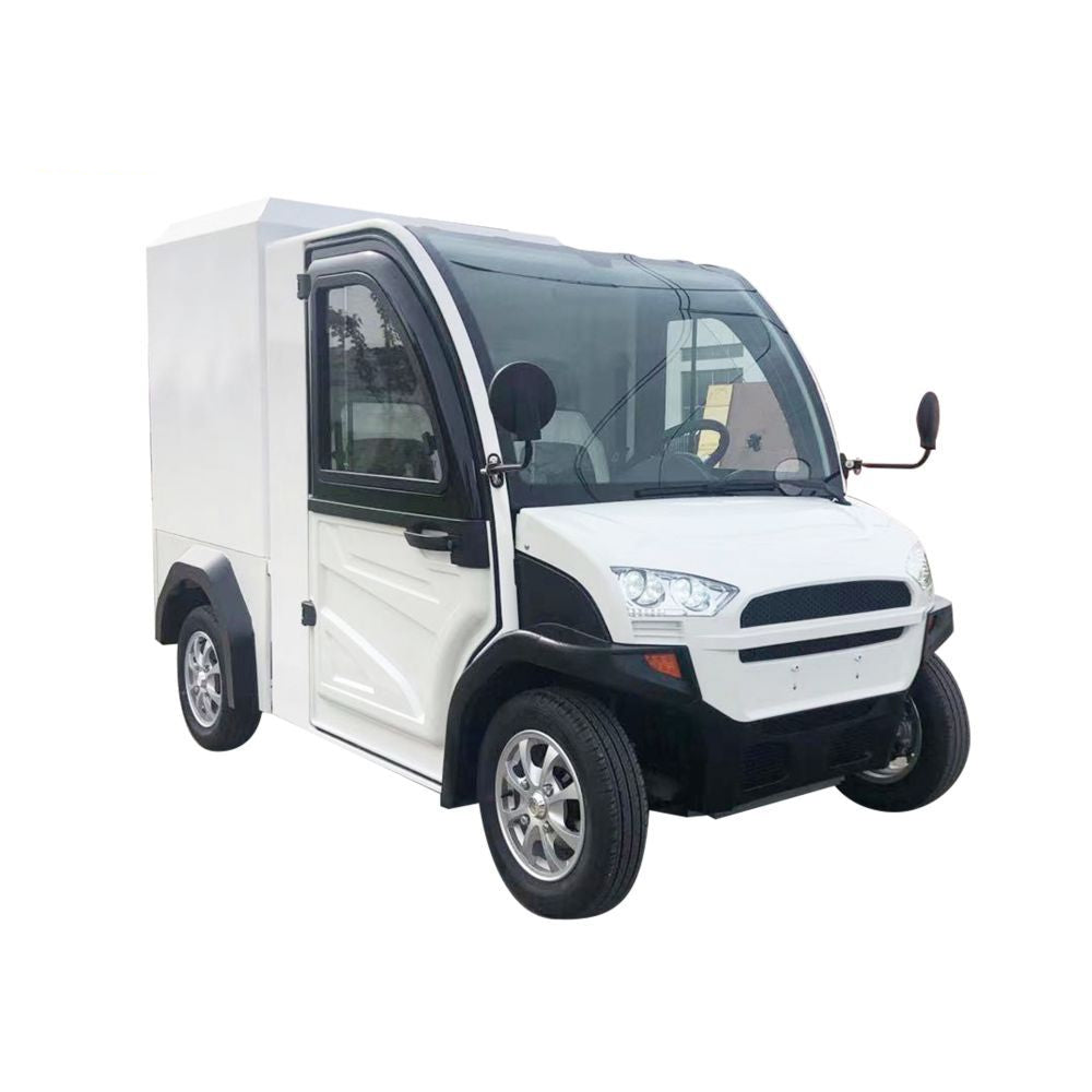 UAE golf cartz three-quarter front studio shot of a white enclosed electric delivery vehicle with a large rear cargo box, set against a pure white background. This two-seater commercial NEV or electric utility truck features a modern front end, black trim, and small, multispoke silver alloy wheels. The vehicle is designed for efficient last-mile delivery and urban logistics.