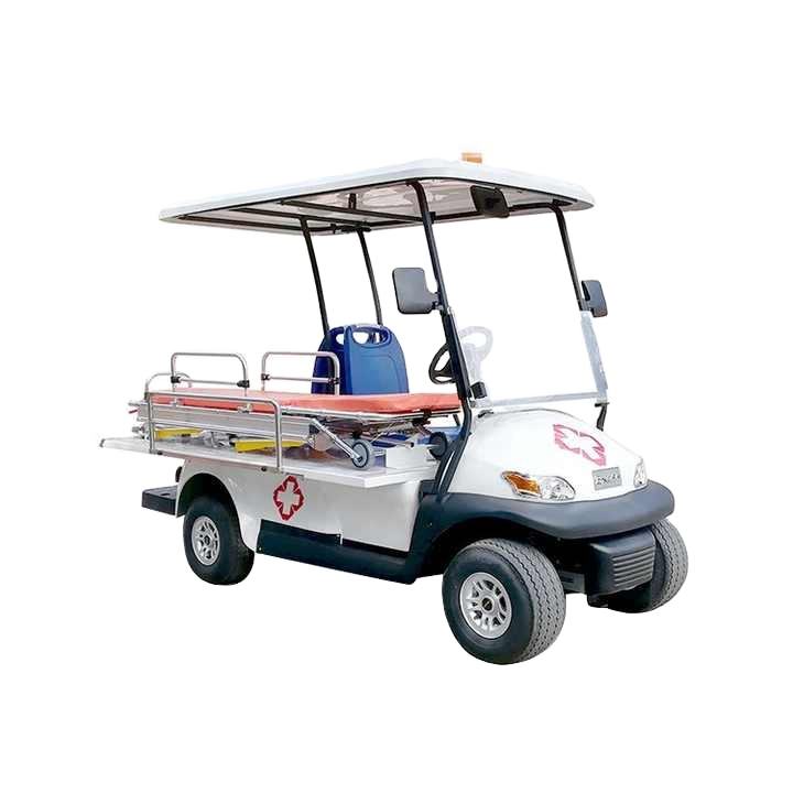 UAE golf cartz studio shot of a white electric ambulance golf cart or medical utility vehicle with a white roof, set against a white background. This emergency response cart is equipped with a stretcher or patient transport bed in the rear, surrounded by chrome safety rails. A red cross medical logo is visible on the side and front hood, highlighting its specialized rescue golf cart function.
