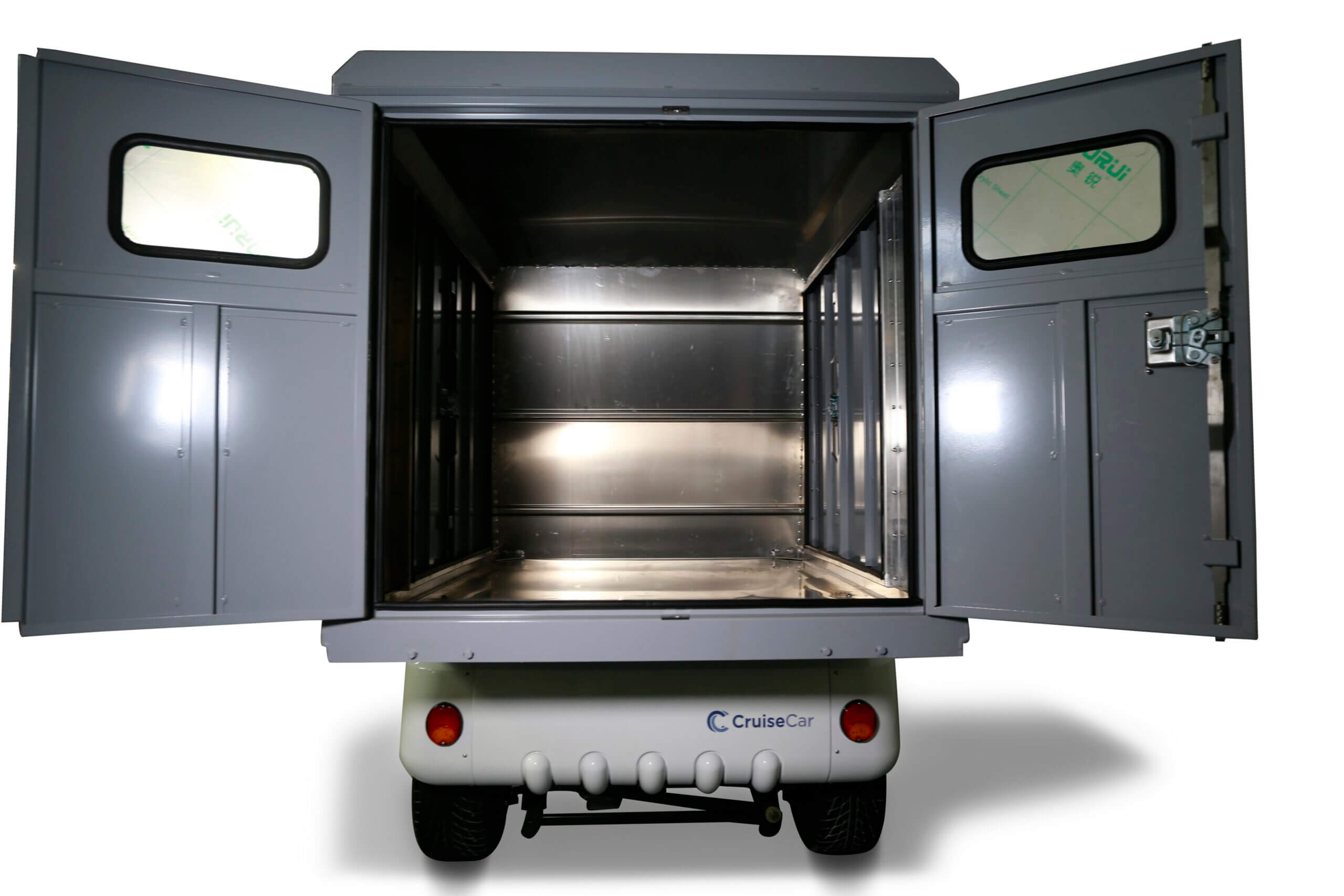 UAE golf cartz rear view of a white utility golf cart with a large, grey enclosed rear cargo box, set against a pure white background. The box's double doors are wide open, revealing the empty, silver-lined interior storage space and a small window on each door. The bottom panel of the electric service vehicle features red taillights and the "CruiseCar" logo, highlighting the maximum delivery and storage capacity of the work cart.
