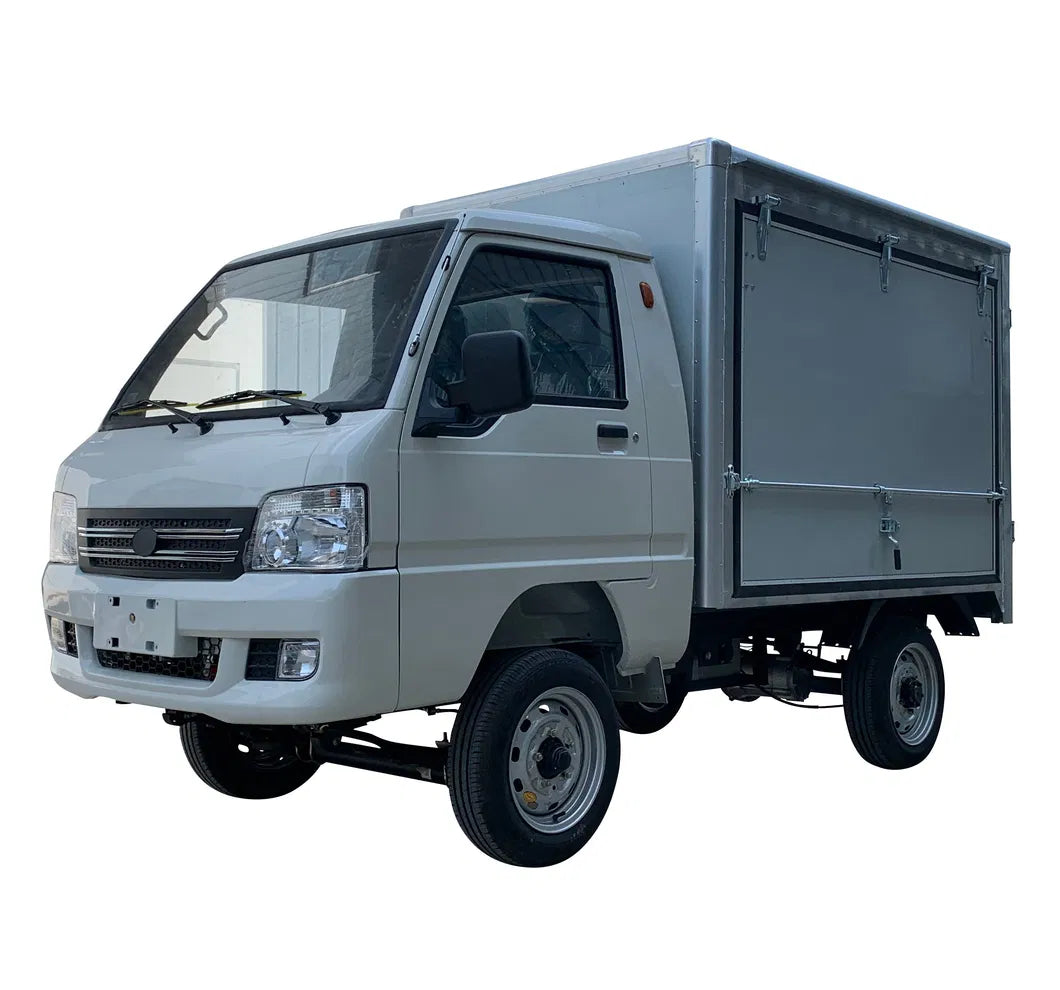 UAE golf cartz three-quarter front studio shot of a white electric box truck with a single cab and an enclosed, silver aluminum cargo box, set against a pure white background. This electric commercial utility vehicle is a compact electric mini truck or delivery van designed for efficient logistics and urban delivery. It features a modern front end and small utility-style wheels.